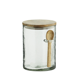 Glazen pot met houten deksel en lepel