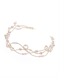 Hair ornament decorated with rose colored pearls