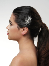 Silver-colored hair jewelry with rhinestones on a comb