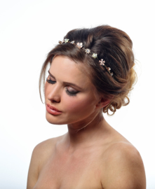 Tiara Margriet: fine metal flowers with hearts of crystal or pearl.