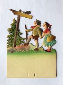 Vintage Duitse gestanst kartonnen kalender houder jongen en meisje