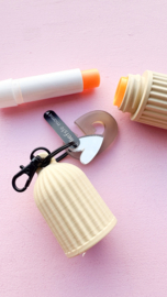 Lippenbalsemhouder met bedels