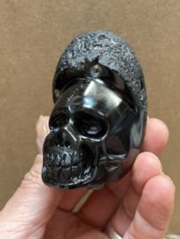 Cintamani human skull
