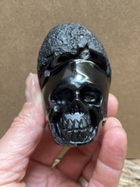 Cintamani human skull