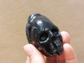 Cintamani human skull