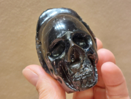 Cintamani human skull