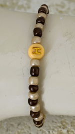 Uit het atelier van Puck. Naam armbandje  'H'.