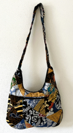 Schoudertas 38 x 29 cm. Hoofdvak en zijvak met rits. Gevoerd.