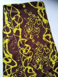 Exclusief batik sjaaltje uit Oost-Java. Choco/geel. 30x195 cm. 100% rayon. Wasbaar op 30 graden.