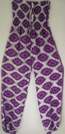 Kinderbroek/jumpsuit fantasy paars van sarongstof. 10/12 jaar.