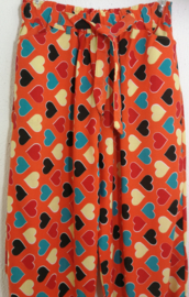 Kinderbroek hartjes oranje. 10/12 jaar.