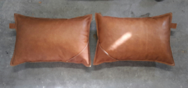 A COUPLE OF LEATHER CUSHIONS. 60 x 40 cm.