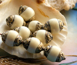 1 beautiful Repoussé Bead from Nepal - 10x14 mm - Faux White Coral