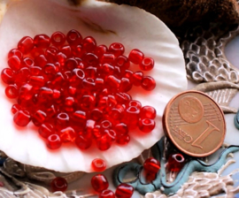 set/100 beads: Spacer Glass - appr 4x3 mm - Transparant Ruby-Red
