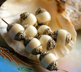 1 beautiful Repoussé Bead from Nepal - 10x14 mm - Faux White Coral