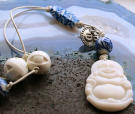 C&G Leather Cord Necklace: Serpentine Buddha & Porcelain beads