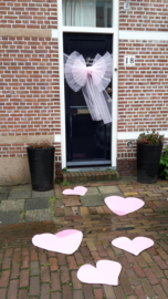 Deurstrik en harten in licht roze