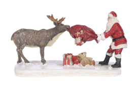 Reindeer teasing Santa