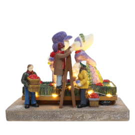 Flower Parade With Kissing Couple