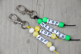 Sleutelhanger top-juf geel