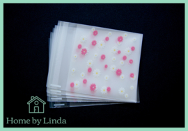 Cellofaan zakjes wit roze bloem 10 cm x 10 cm (set van 10 stuks)