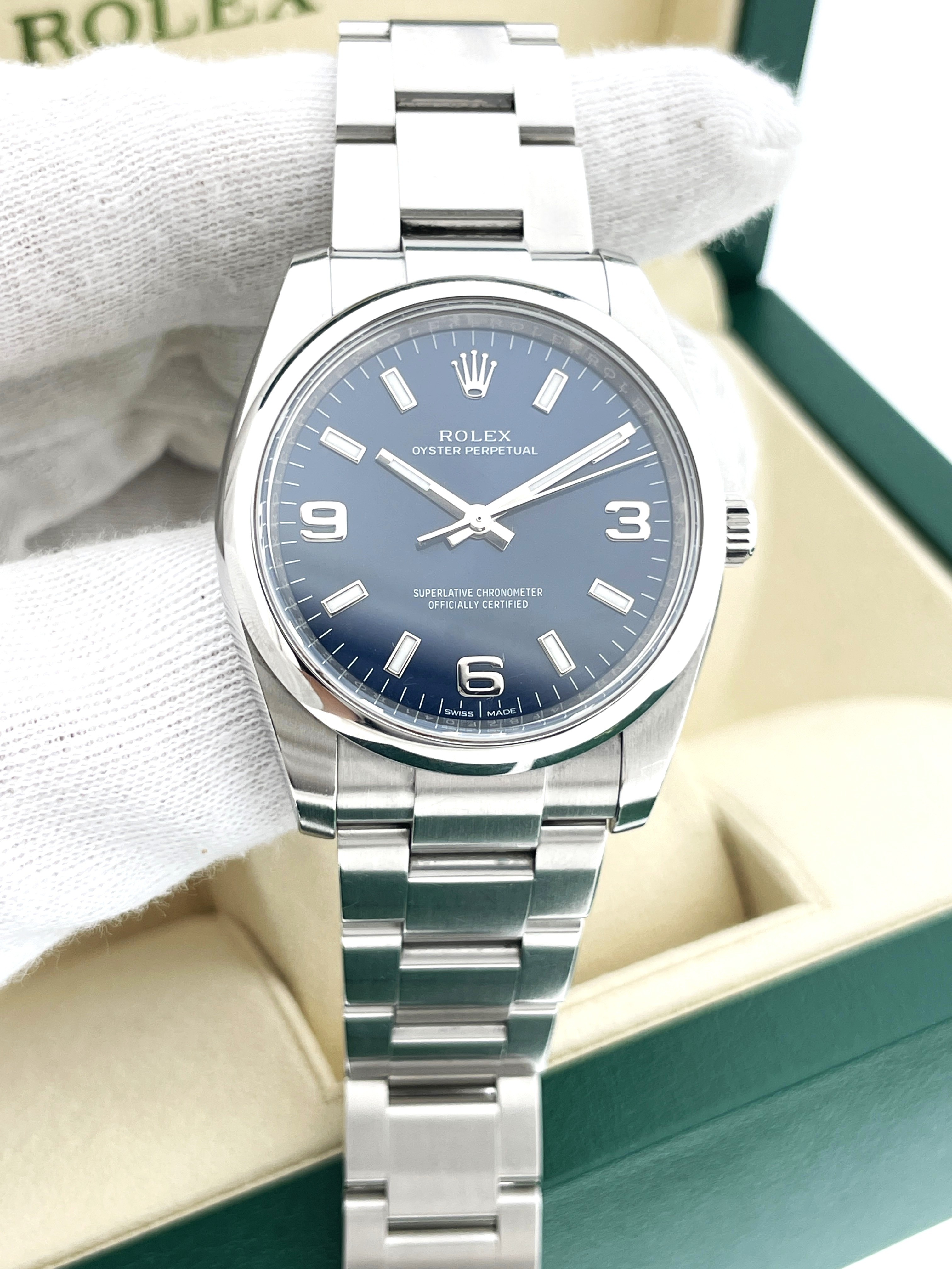 Rolex Oyster Perpetual 114200 Staal Blue Baton Arabic Dial 34 mm - Full set / 2016
