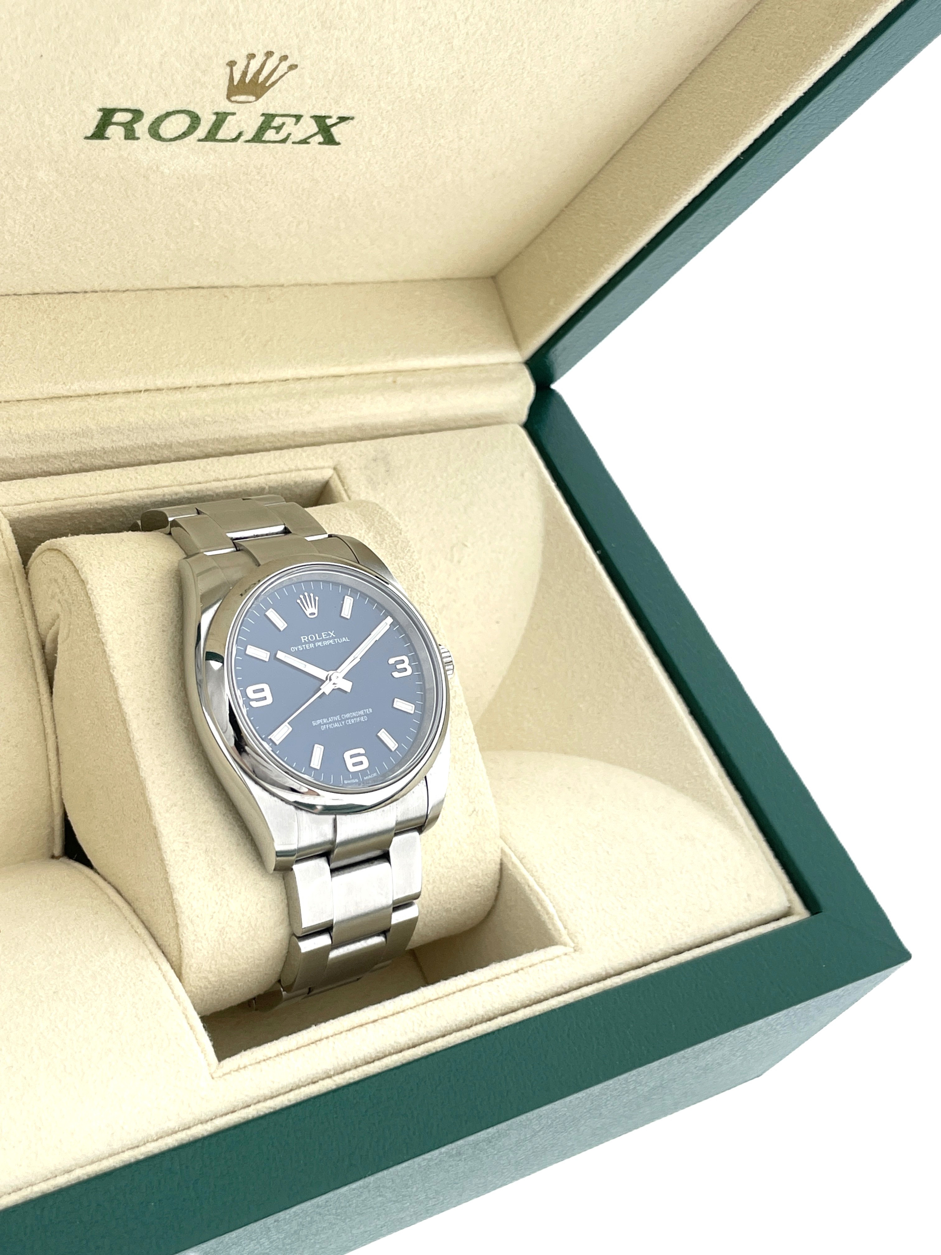 Rolex Oyster Perpetual 114200 Staal Blue Baton Arabic Dial 34 mm - Full set / 2016