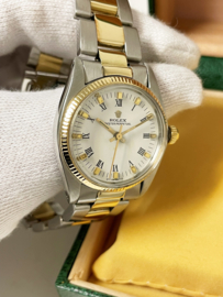 Rolex Oyster Perpetual 6751 White Roman Dial 31 mm - Staal / Goud