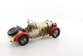 A TIN MODEL OF AN OLDTIMER white