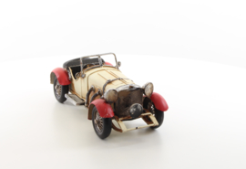 A TIN MODEL OF AN OLDTIMER white