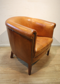 Schapenlederen clubfauteuil met hocker