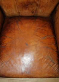 Antieke lederen clubfauteuil