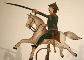 Antieke tuimelaar man te paard