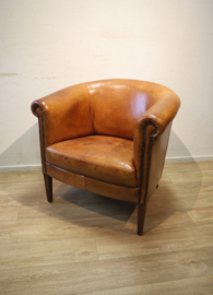 Schapenlederen clubfauteuil met hocker