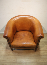 Schapenlederen clubfauteuil met hocker
