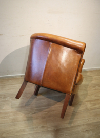 Schapenlederen clubfauteuil met hocker