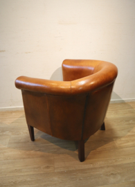 Schapenlederen clubfauteuil met hocker