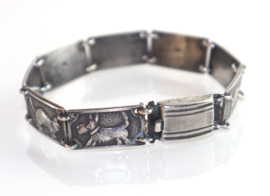 Vintage zilveren armband met katten en honden.