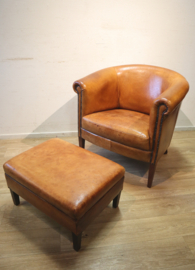 Schapenlederen clubfauteuil met hocker