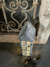 Metalen huisje, middel