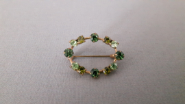 Vintage broche met groene strass