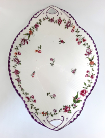 Vintage schaal van porselein met bloemenrand