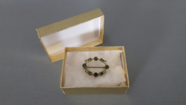 Vintage broche met groene strass