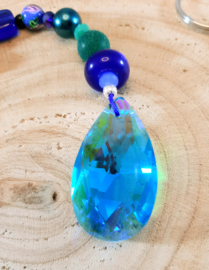 Suncatcher met blauw koord, zeester en klavertje vier