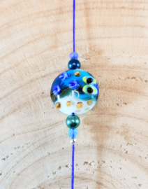 Suncatcher met blauw koord, zeester en klavertje vier