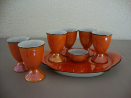 Vintage oranje eierdopjes met onderschaaltje - VERKOCHT