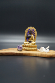 Golden and black Buddha with blue led light