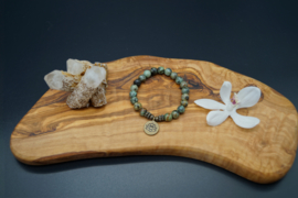 Bracelet with African turquoise beads and lotus charm