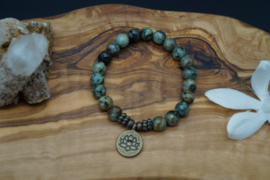 Bracelet with African turquoise beads and lotus charm