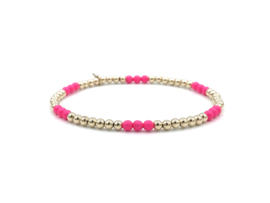 Armband Novi met real gold plated balletjes en neon roze Swarovski pareltjes